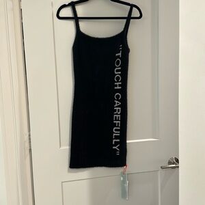 Off white “touch carefully “ fuzzy dress never been worn new with tags